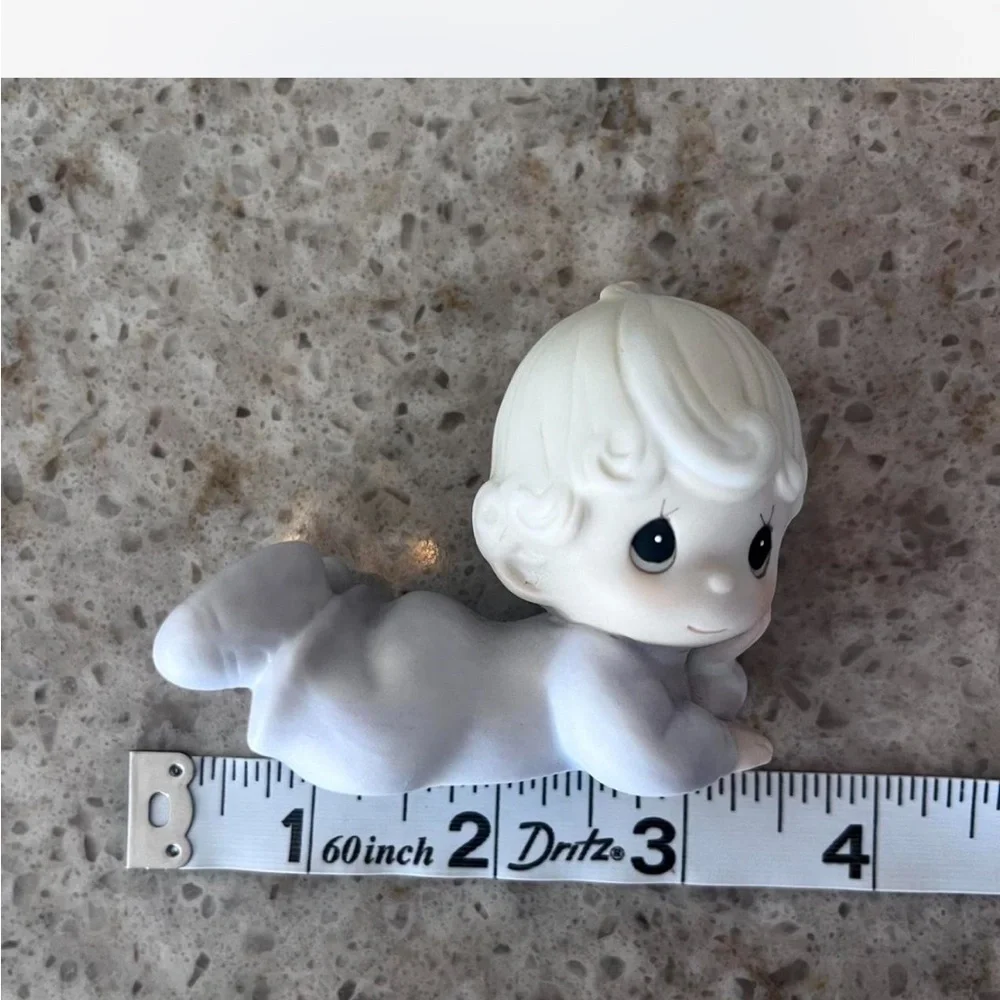 Adorable Precious Moments little girl lying down figurine in excellent condition